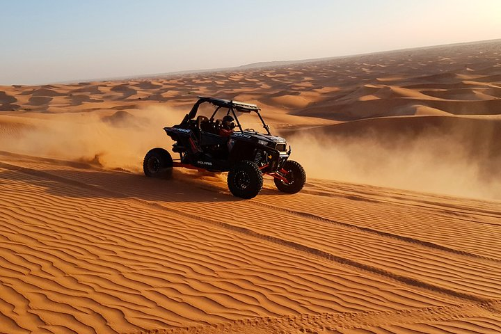 Experience the thrill of dune bashing against the stunning backdrop of sprawling red sand dunes. Feel the rush as you navigate the desert's breathtaking landscape on a custom dune buggy adventure.